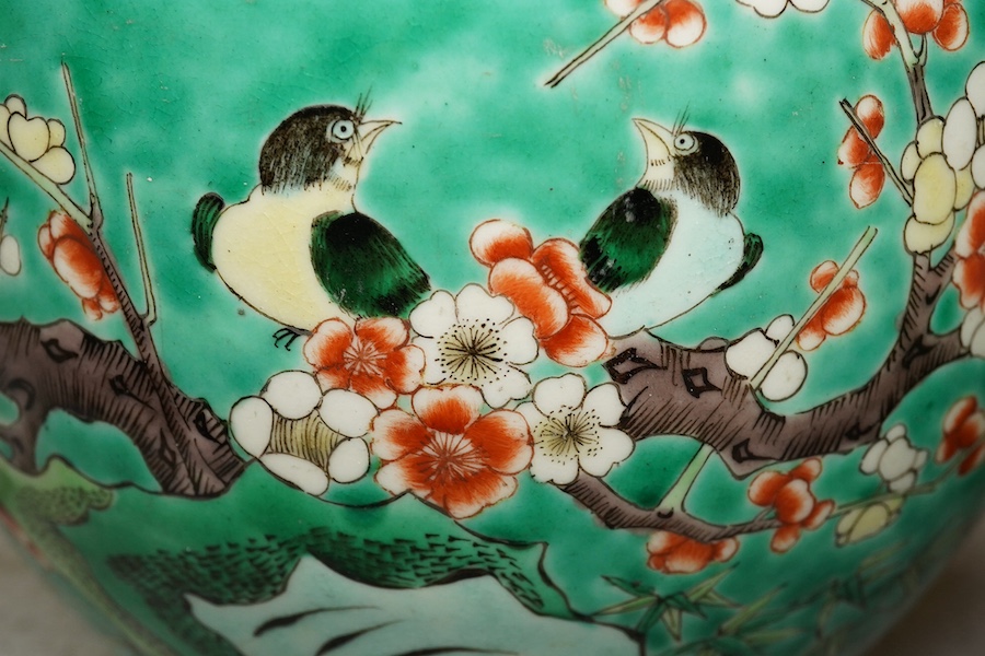 A pair of Chinese famille verte green ground jardinieres, Kangxi marks, but late 19th century